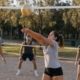 Recreational volleyball players practicing together at an outdoor court